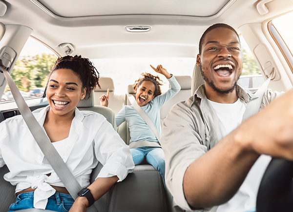 A family sitting in their car